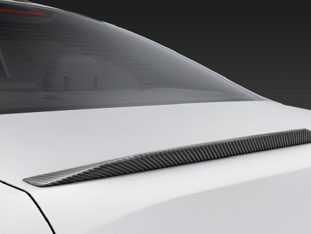 Carbon fibre rear spoiler business sedan.